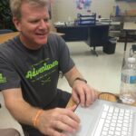 Smiling Man at Computer